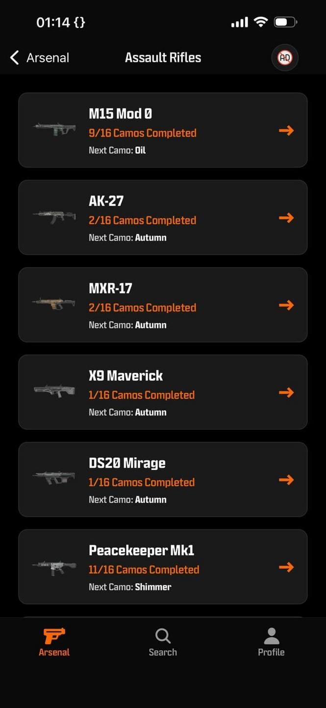 Detailed close-up of a mobile device displaying the BO7 CAMOTRACKER app with challenge checkboxes, progress bars, and dark interface, set against a gamer’s desk with gaming peripherals in low light.